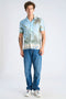 Front image of a model wearing the Aop summer viscose shirt in sky, by brand Lindbergh