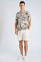 Front image of a model wearing the Aop vintage shirt in all over print, by brand Lindbergh