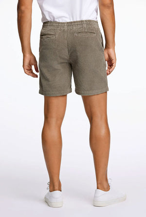 Back image of a model wearing the Corduroy relaxed fit shorts in khaki, by brand Lindbergh