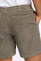 Back image of a model wearing the Corduroy relaxed fit shorts in khaki, by brand Lindbergh