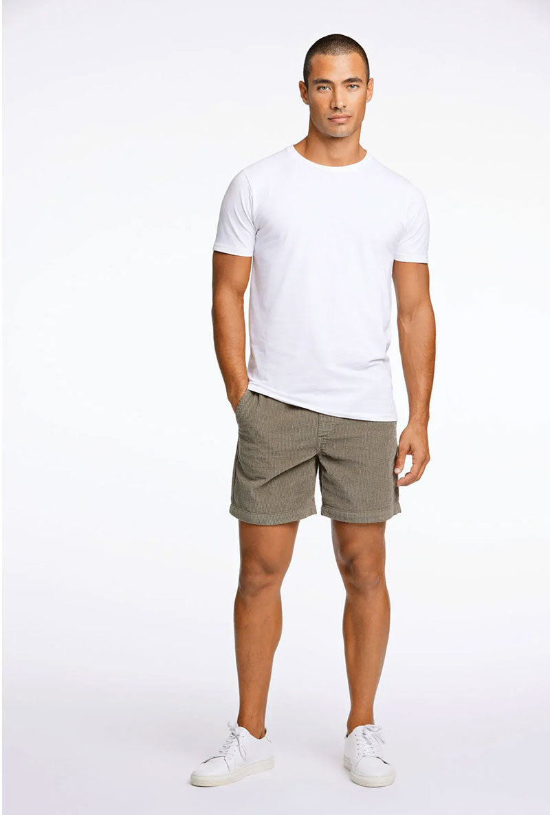 Front image of a model wearing Corduroy relaxed fit shorts in khaki, by brand Lindbergh