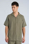Front image of a model wearing Cotton muslin resort shirt in sage, by brand Lindbergh