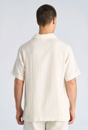 Back image of a model wearing the Cotton muslin resort shirt in off white, by brand Lindbergh