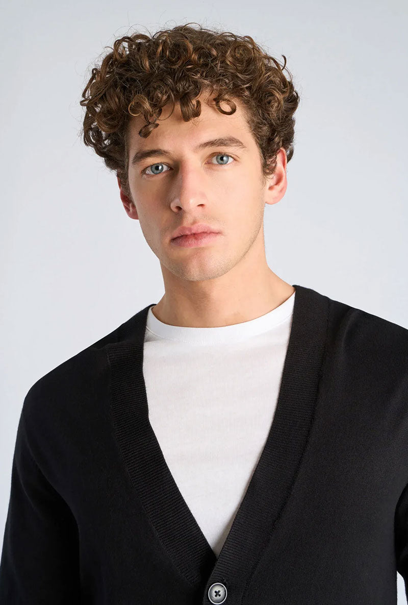Front image of a model wearing Ecovero vneck cardigan in black, by brand Lindbergh