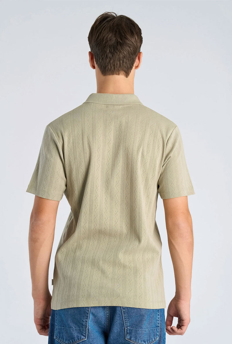 Back image of a model wearing Jacquard vneck polo in olive, by brand Lindbergh