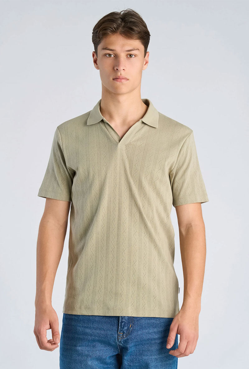 Front image of a model wearing Jacquard vneck polo in olive, by brand Lindbergh
