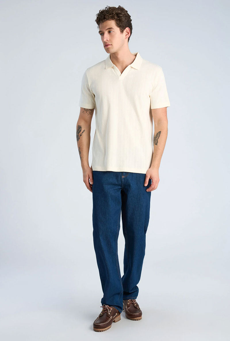 Front image of a model wearing Jacquard vneck polo in off white, by brand Lindbergh
