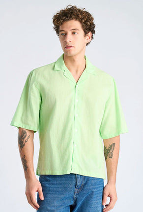 Front image of a model wearing Linen blend cropped shirt in green, by brand Lindbergh