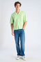 Front image of a model wearing the Linen blend cropped shirt in green, by brand Lindbergh