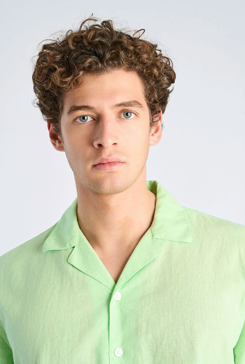 Front image of a model wearing Linen blend cropped shirt in green, by brand Lindbergh