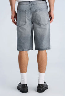 Back image of a model wearing the Loose fit denim shorts in grey, by brand Lindbergh