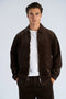 Front image of a model wearing Seersucker corduroy zip jacket in brown, by brand Lindbergh