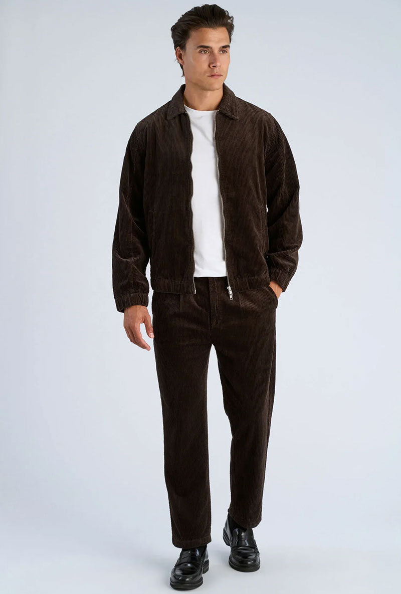 Front image of a model wearing Seersucker corduroy zip jacket in brown, by brand Lindbergh
