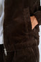 Front image of a model wearing the Seersucker corduroy zip jacket in brown, by brand Lindbergh