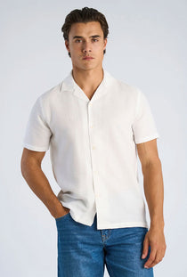 Front image of a model wearing the Solid dobby s/s shirt in white, by brand Lindbergh