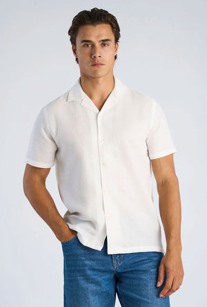 Front image of a model wearing the Solid dobby s/s shirt in white, by brand Lindbergh
