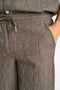 Front image of a model wearing the Textured shorts in khaki, by brand Lindbergh
