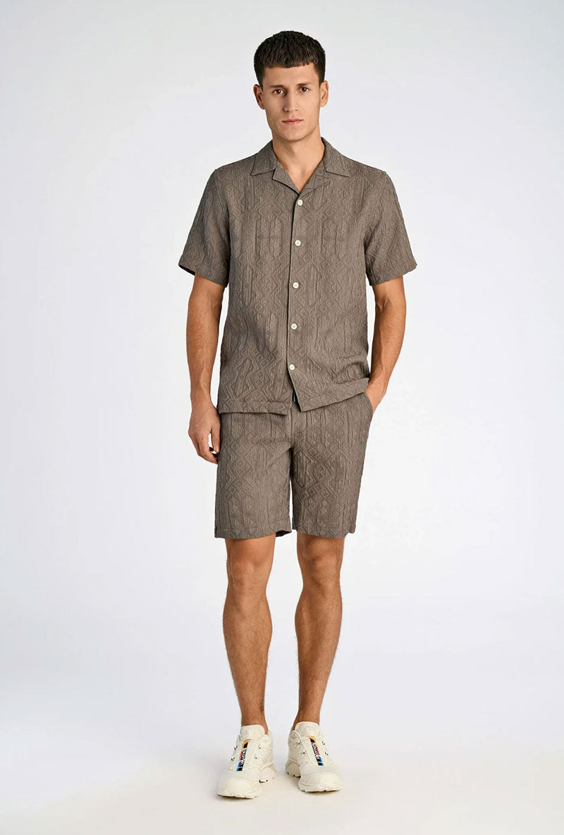 Front image of a model wearing Textured ss shirt in khaki, by brand Lindbergh