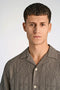 Front image of a model wearing the Textured ss shirt in khaki, by brand Lindbergh