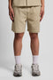 Front image of a model wearing Crinkle resort shorts in stone, by brand Lyle and scott