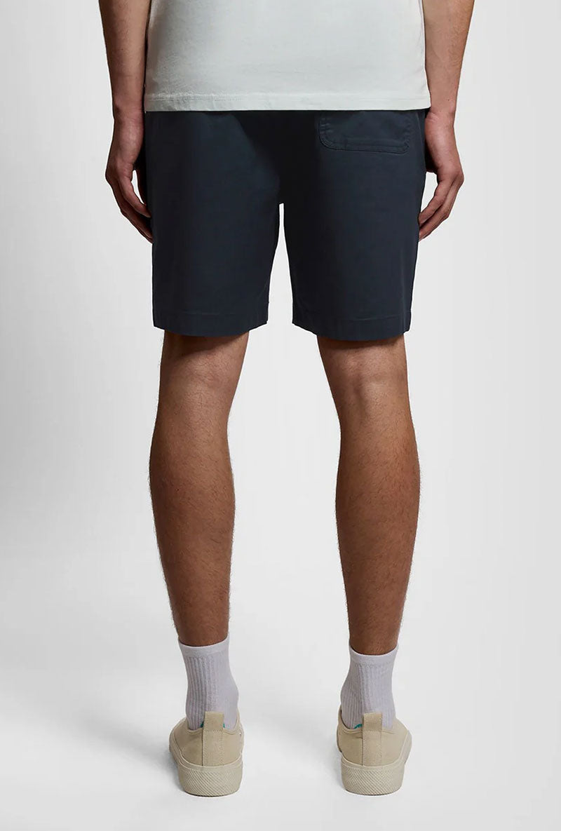 Back image of a model wearing Everyday shorts in navy, by brand Lyle and scott
