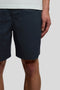 Front image of a model wearing the Everyday shorts in navy, by brand Lyle and scott