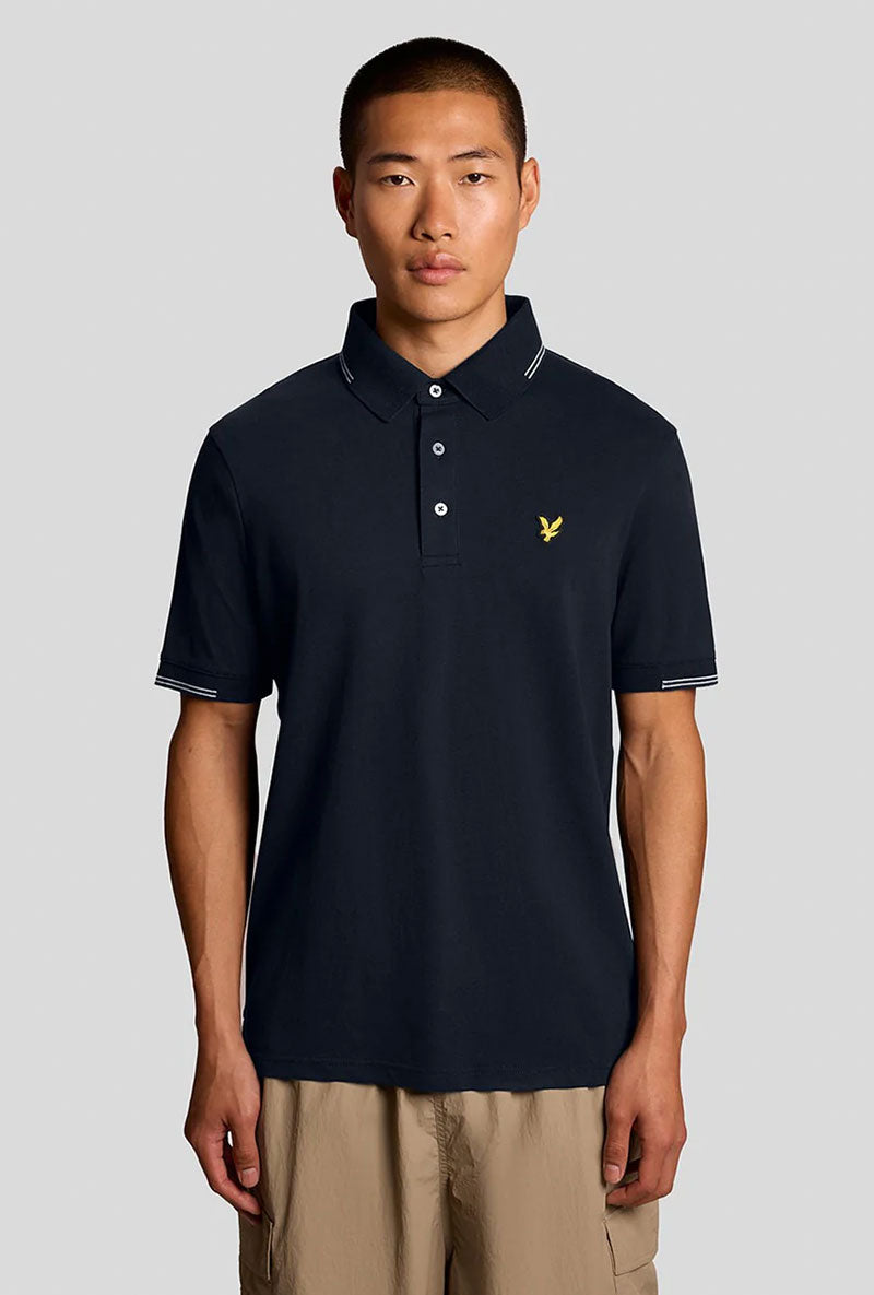 Front image of a model wearing Fine tipped polo in navy, by brand Lyle and scott