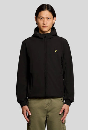 Front image of a model wearing Fleece back softshell jacket in black, by brand Lyle and scott