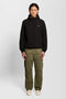 Front image of a model wearing the Fleece back softshell jacket in black, by brand Lyle and scott