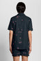 Back image of a model wearing the Goldfish resort shirt in navy, by brand Lyle and scott