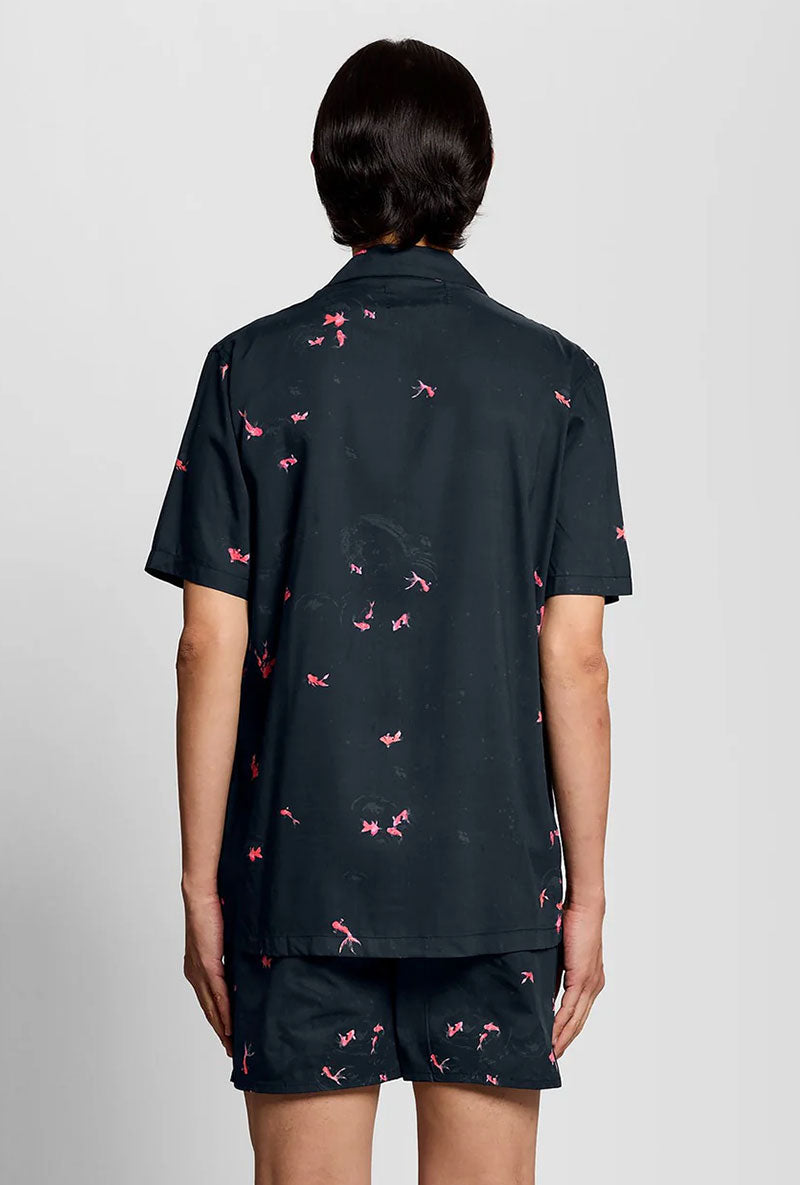 Back image of a model wearing Goldfish resort shirt in navy, by brand Lyle and scott