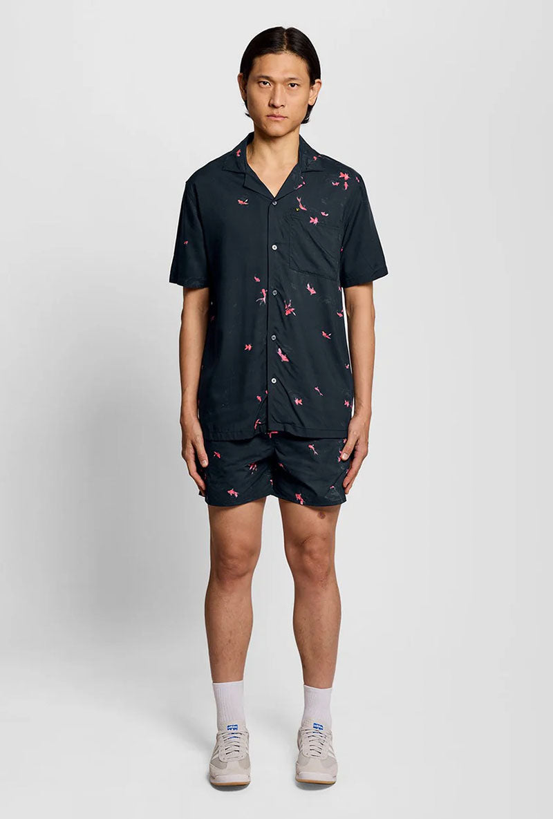 Front image of a model wearing Goldfish resort shirt in navy, by brand Lyle and scott