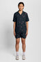 Front image of a model wearing the Goldfish resort shirt in navy, by brand Lyle and scott