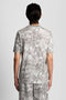 Back image of a model wearing the Industrial print t in grey, by brand Lyle and scott