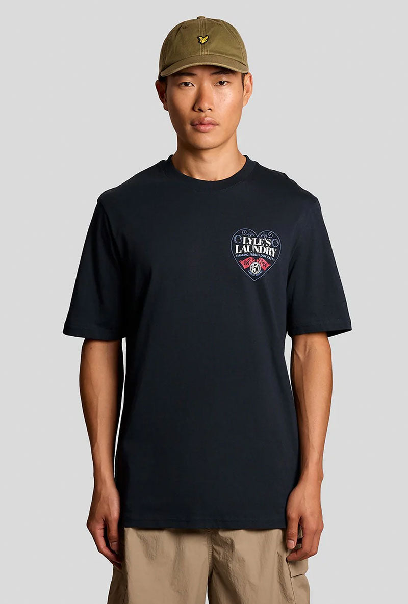Front image of a model wearing Lyles laundry graphic t in navy, by brand Lyle and scott