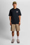 Front image of a model wearing the Lyles laundry graphic t in navy, by brand Lyle and scott