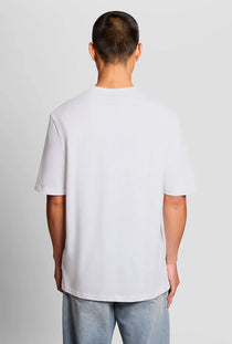 Back image of a model wearing the Lyles laundry graphic t in white, by brand Lyle and scott