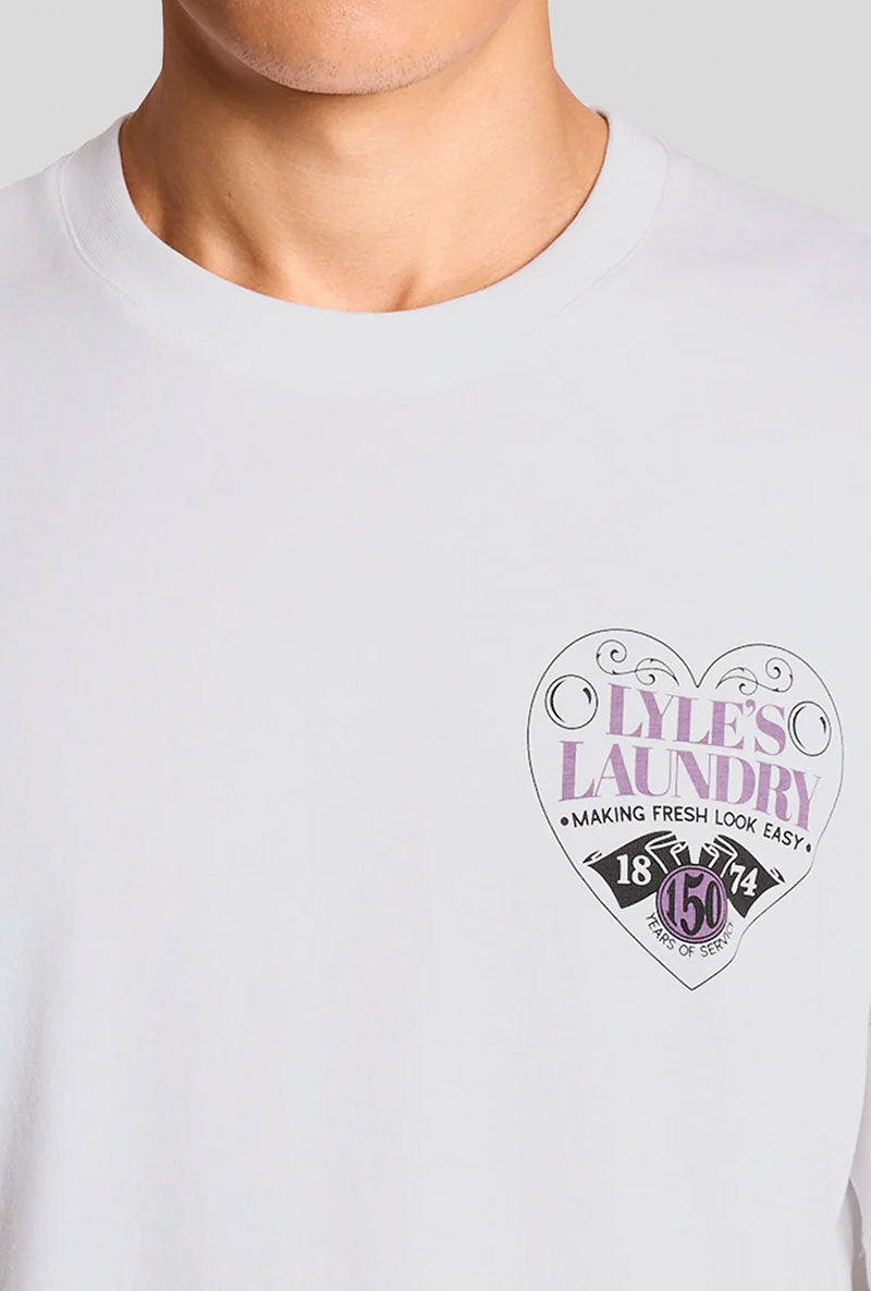 Front image of a model wearing Lyles laundry graphic t in white, by brand Lyle and scott