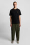 Front image of a model wearing the Plain logo tshirt in black, by brand Lyle and scott
