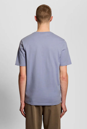 Back image of a model wearing the Plain logo tshirt in blue, by brand Lyle and scott