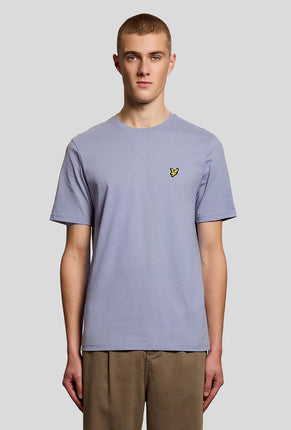 Front image of a model wearing Plain logo tshirt in blue, by brand Lyle and scott