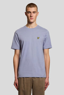 Front image of a model wearing the Plain logo tshirt in blue, by brand Lyle and scott