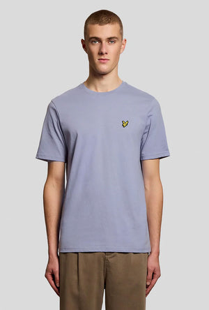 Front image of a model wearing the Plain logo tshirt in blue, by brand Lyle and scott