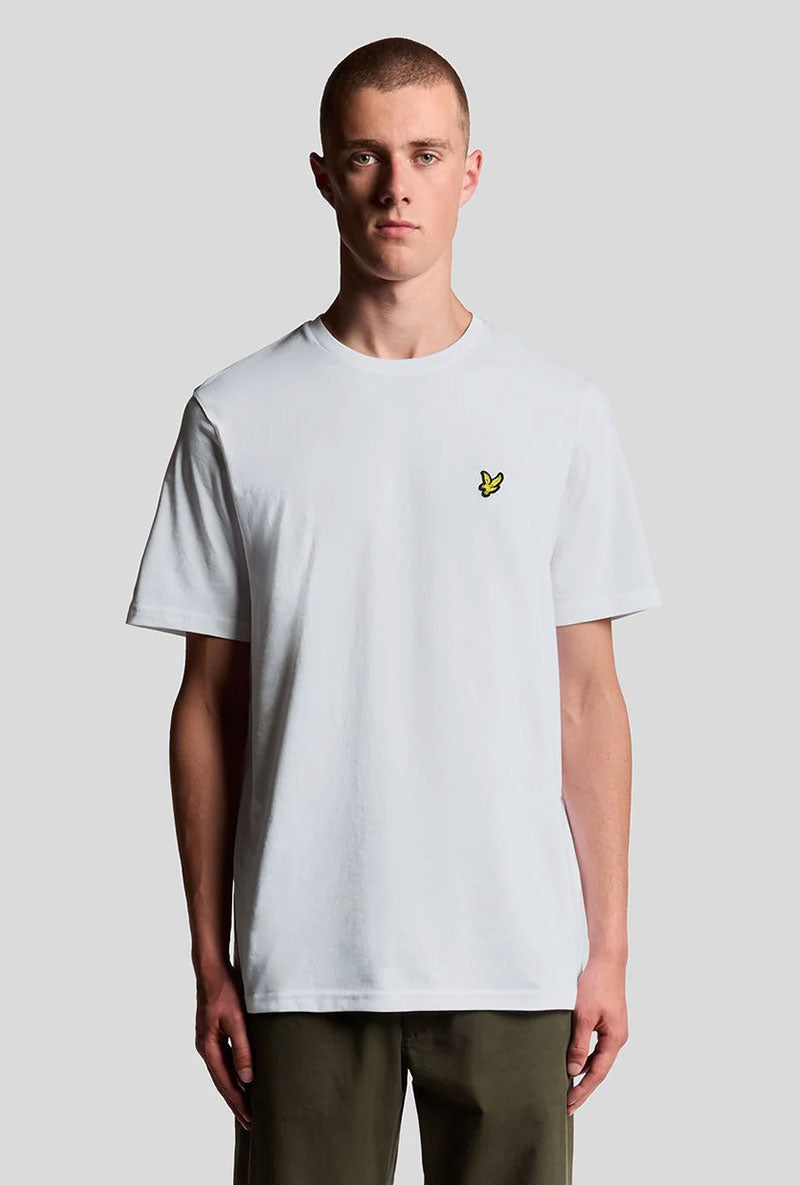 Front image of a model wearing Plain logo tshirt in white, by brand Lyle and scott