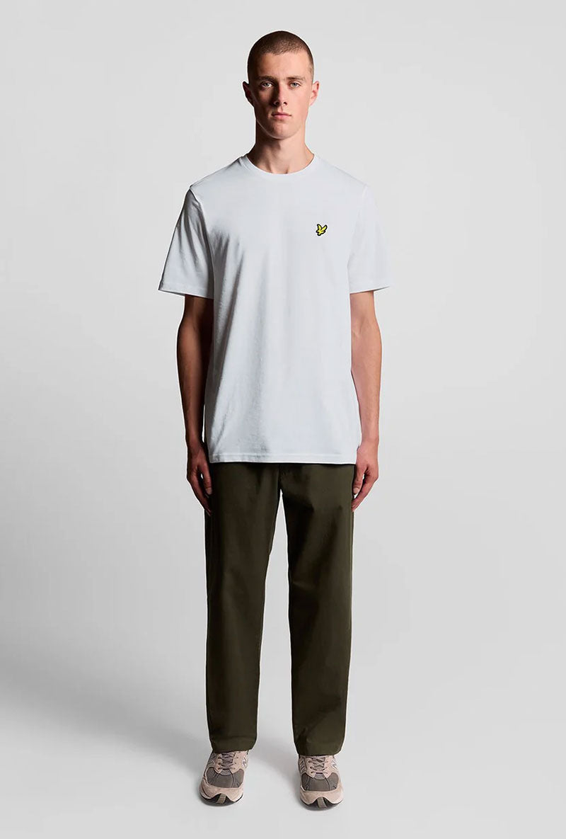 Front image of a model wearing Plain logo tshirt in white, by brand Lyle and scott