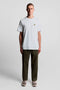 Front image of a model wearing the Plain logo tshirt in white, by brand Lyle and scott