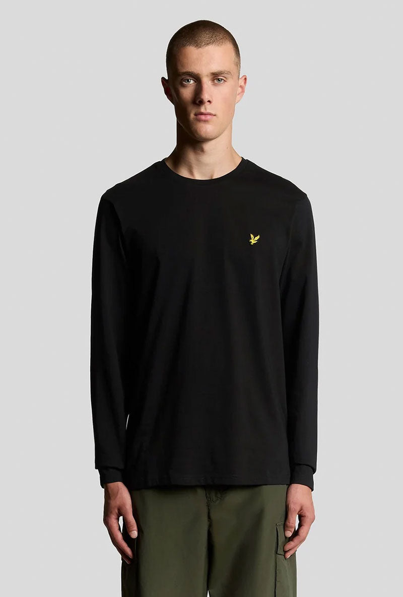 Front image of a model wearing Plain ls tshirt in black, by brand Lyle and scott