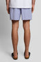 Back image of a model wearing the Plain swimshorts in blue, by brand Lyle and scott
