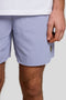 Front detail image of a model wearing the Plain swimshorts in blue, by brand Lyle and scott