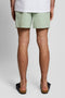 Back image of a model wearing the Plain swimshorts in sage, by brand Lyle and scott